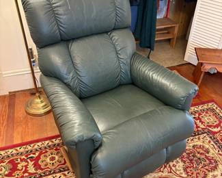  R30 - $100. La-Z-Boy rocker recliner in green leather.  Good condition, no holes or rips noted.  Measures 33" x 36" x 39" tall. 