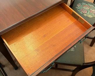 R24 - $250. Georgetown galleries mahogany dropleaf table with eight chair chairs. Fully opened it measures 42" x 74" x 30" tall. With the leaves down it is only 26.5" wide. Very good vintage condition. Has a storage drawer on either side that slide easily.