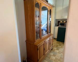 R44 - $175. Maple China Cabinet from Cherokee furniture. Appears to move in one piece. Measures 46" x 17"  x 72.5" tall. Very good vintage condition. 
