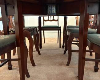 R24 - $250. Georgetown galleries mahogany dropleaf table with eight chair chairs. Fully opened it measures 42" x 74" x 30" tall. With the leaves down it is only 26.5" wide. Very good vintage condition. Has a storage drawer on either side that slide easily.