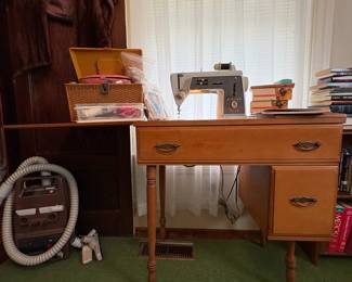 R2 - $60. Singer, touch & sew,  sewing machine in table. Includes power cord and foot pedal.