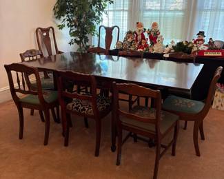 R24 - $250. Georgetown galleries mahogany dropleaf table with eight chair chairs. Fully opened it measures 42" x 74" x 30" tall. With the leaves down it is only 26.5" wide. Very good vintage condition. Has a storage drawer on either side that slide easily.