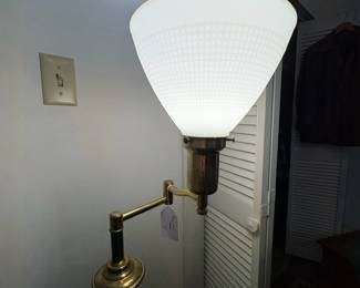 R29 - $50. Brass floor lamp with swinging arm good vintage condition. Works great. 54" tall.