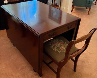 R24 - $250. Georgetown galleries mahogany dropleaf table with eight chair chairs. Fully opened it measures 42" x 74" x 30" tall. With the leaves down it is only 26.5" wide. Very good vintage condition. Has a storage drawer on either side that slide easily.