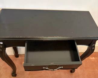 R25 -  $30. Small Black side table. Measures 32" x 13" x 30.5" tall. Has single drawer that slides. 