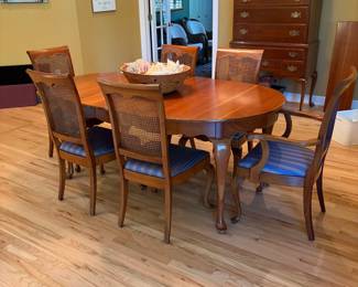 Cherry dining set with cane back chairs, two leaves and pads $800