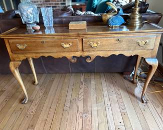 Vintage 2 drawer console/entry table w slide out drink trays on both ends, finished both sides. Labeled Oxford 1981 52w x 15.5d x 29.5h