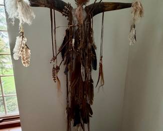 Native American style horned skull with feathers