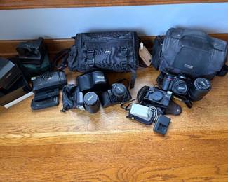 several cameras and lenses - Nikon N8008, L35, D7200 - Sony Cybershot + Polaroids