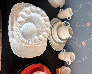 Assorted Kitchenware & Serving Dishes – Orange Fiesta platter, decorative ceramic deviled egg dish, Pyrex casserole dish, ceramic serving platters, bowls, mugs, and covered dishes. Items sold individually unless noted.
