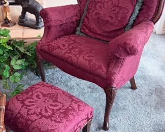 Vintage wingback floral upholstered chair with matching footrest.
