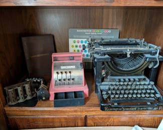 Toy register, change dispenser and a very heavy typewriter