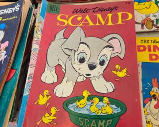 $3 Dell Walt Disney's comic books - as is - basement smell