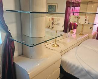Here is the photo of the headboard with built in and tables mirrors and shelves