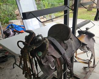 2 Saddle  racks $125 each plus several saddles 