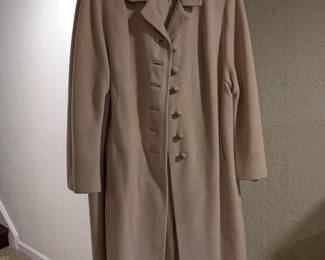 Vintage tan wool cashmere long coat with fabric-covered buttons, classic 1960s style.