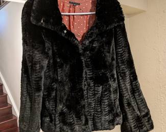 Sisley black faux fur jacket with polka dot lining. Short, cropped style.