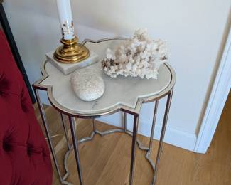 Marble top quatrefoil side table with polished chrome frame. Hollywood Regency style.