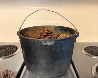 Antique or vintage cast-iron pot, kettle, or small cauldron (sometimes referred to as a gypsy pot, bean pot, or hearth kettle)