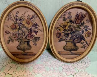 Pair of floral urn oval pictures