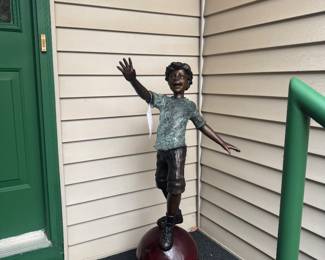 Bronze boy on Ball 