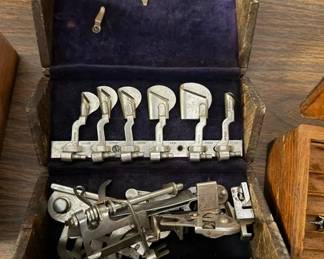 Singer sewing machine puzzle box accessories.