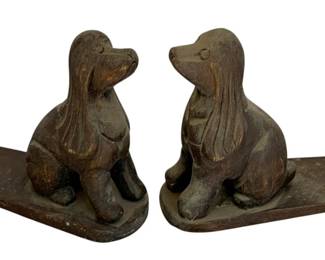 1115 - Pair Wood Dog Bookends 7.5"x8"x3.5" (Description): A pair of carved wood dog bookends featuring seated hound figures with long ears and expressive faces. Each bookend measures 7.5 inches by 8 inches by 3.5 inches.