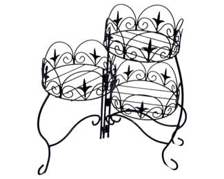 1066 - 3 Tier Metal Planter 22"x24" (Description): Three tier metal planter with decorative scrollwork design. Features ornate fleur-de-lis motifs and curved wire construction throughout each tier. Measures 22 inches by 24 inches.