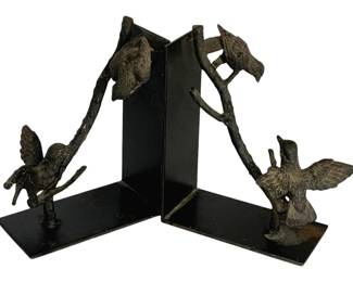 1085 - Pr Metal Bird Bookends 8"x6.5"x3.5" (Description): Pair of metal bird bookends featuring decorative birds perched on branches. Each bookend measures 8 inches by 6.5 inches by 3.5 inches.