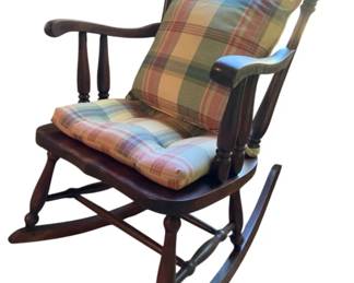751 - Wooden Rocking Chair 36"x23"x34" (Description): Wooden rocking chair with classic spindle back design and turned legs. Measures 36 inches high by 23 inches wide by 34 inches deep.
