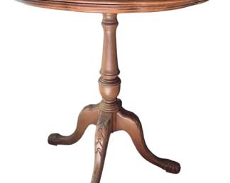 334 - Vintage Mahogany Tea Table 27"x24" (Description): Featuring a round top with raised edge, turned pedestal base, and tripod legs with carved details terminating in ball and claw feet. Measures 27 inches by 24 inches.