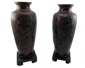 319 - Pair Japanese Heavy Baluster Vases (Description): Set of two heavy vases featuring raised floral and bird motifs. Each vase rests on a footed base. Measurements: 12 inches by 5 inches.