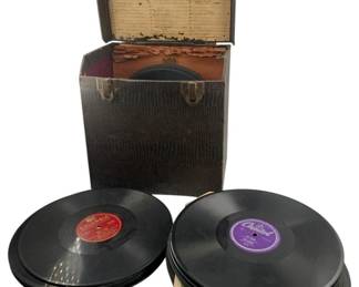 812 - Vinyl Records & Box (Description): A collection of vinyl records accompanied by a storage box. The lot includes multiple records from various labels housed in a vintage-style carrying case with organizational dividers and a hinged lid.