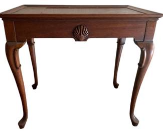 346 - Queen Anne Mahogany Tea Table (Description): Mahogany side table featuring a carved shell motif on the apron and elegant cabriole legs. Measures 25 inches wide by 18 inches deep by 28 inches tall.