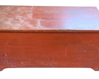 1032 - Painted Red Wood Trunk w/ Contents (Description): Painted red wood trunk with contents. The trunk measures 17.5 inches wide by 31.5 inches long by 18 inches tall.