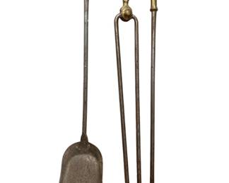 321 - Brass & Iron Fireplace Tools (Description): A set of brass and iron fireplace tools featuring decorative urn-shaped brass finials. The set includes a shovel and tongs. Each piece measures 30 inches in length.