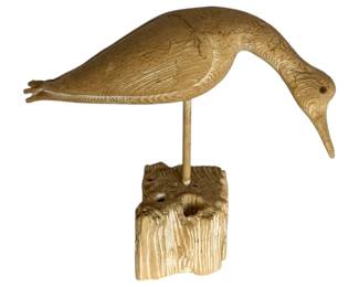 1049 - Carved Wood Shore Bird 12"x13"x5" (Description): A carved wood bird figure mounted on a naturalistic wooden base. The piece measures 12 inches by 13 inches by 5 inches.
