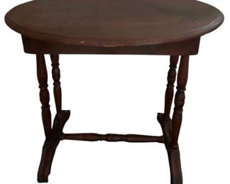 730 - Oval Wood Table w/ Drawer 27"x30"x20" (Description): Wooden table featuring drawers for storage. The table has turned legs with a stretcher base. Measures 27 inches by 30 inches by 20 inches.