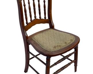 1069 - Wood Chair 33"x17"x17" (Description): Wood chair featuring a spindle back design with turned supports and an upholstered seat. The chair rests on turned legs connected by stretchers. Measures 33 inches high by 17 inches wide by 17 inches deep.