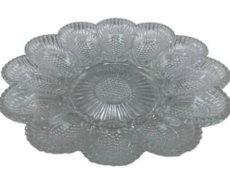 279 - Vintage Deviled Egg Platter 9.5" (Description): Featuring a decorative hobnail pattern with individual wells for displaying deviled eggs around a central serving area. Measures 9.5 inches in diameter.