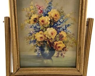 724 - Vtg Framed Floral Print w/ Stand 12"x10"x3" (Description): Vintage framed floral print presented in a decorative gilded frame with an ornate stand. The frame features detailed carved molding and side supports that allow it to stand upright on a decorative pedestal base. Measures 12 inches by 10 inches by 3 inches.