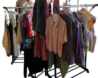 771 - Huge Group Lot of Clothes & More w/ Racks (Description): A group lot of clothes and more, sold together with clothing racks. This assortment includes various garments and accessories, providing a diverse selection of items.