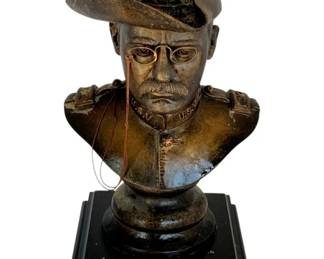 1089 - Teddy Roosevelt Statue 12" (Description): Teddy Roosevelt statue measuring 12 inches. The piece depicts Colonel Theodore Roosevelt in military uniform mounted on a decorative base with commemorative plaque featuring a quote from Roosevelt's autobiography.