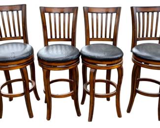 1063 - 4 Barstools w/ Backs 43"x17"x17" / 28" seat (Description): Set of four barstools with backs featuring wooden frames and black upholstered swivel seats. Each stool measures 43 inches tall by 17 inches wide by 17 inches deep with a 28 inch seat height.