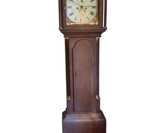 359 - Antique Wood Grandfather Clock 82"x18"x9" (Description): Antique wooden grandfather clock featuring a traditional tall case design with an arched bonnet top housing a painted dial face with Roman numerals and decorative corner spandrels. The clock has an arched door panel on the trunk section and stands on a bracket base. Measures 82 inches tall by 18 inches wide by 9 inches deep. Used as-is electric/electronic/mechanical item. No guarantee all components present, untested if