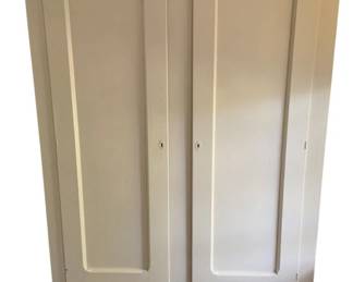 777 - White Painted Wardrobe 78"x50"x24" (Description): White painted wardrobe featuring two paneled doors with keyhole escutcheons and two lower drawers with wooden knob pulls. Raised on tapered feet. Measures 78 inches high by 50 inches wide by 24 inches deep.