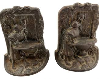 767 - Pair Art Nuveau Bronze Bookends (Description): Pair of metal bookends measuring 5 inches by 4 inches by 3 inches.