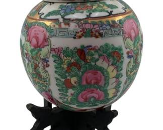 308 - Covered Asian Jar on Stand 7.5"x4" (Description): A covered jar displayed on a decorative stand. The jar features a lidded design with ornate painted decoration. Measures 7 1/2 inches by 4 inches.