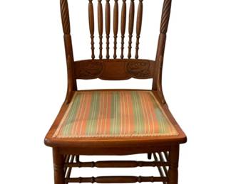 358 - Upholstered Seat Wood Chair (Description): Upholstered seat wood chair featuring a carved back and spindle details. The seat is upholstered in a striped fabric.