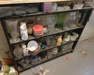 192 - Black Shelf with Contents (Description): 37 x 42 x 8